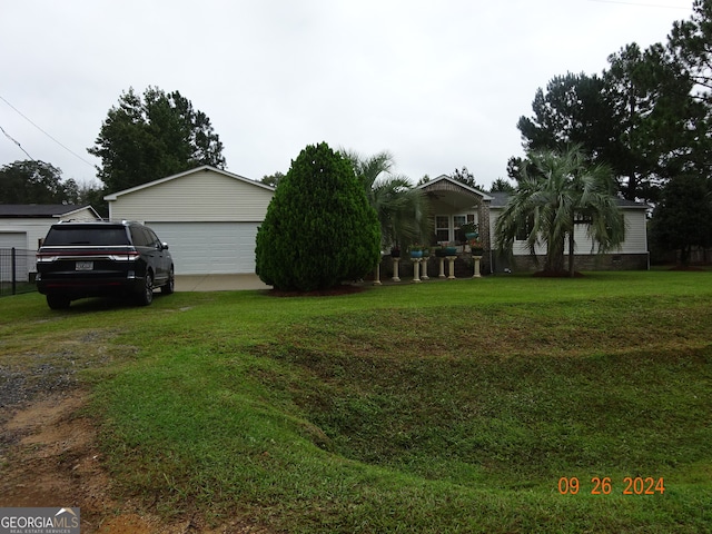 view of yard with a garage