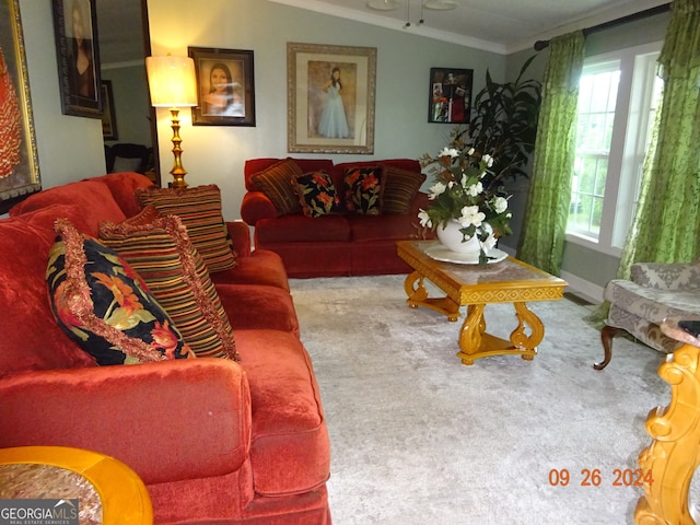 living room featuring lofted ceiling, crown molding, and carpet flooring