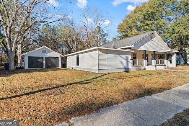 ranch-style home featuring covered porch and a front lawn