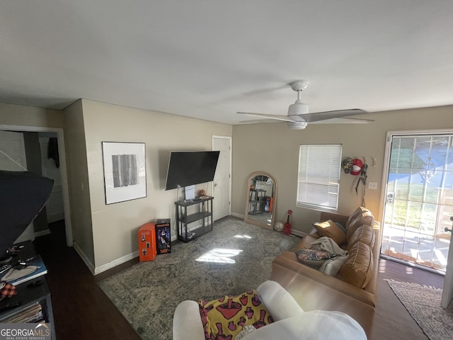 living room with ceiling fan and hardwood / wood-style floors