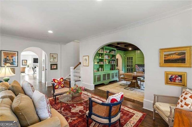 living room with crown molding and dark hardwood / wood-style floors