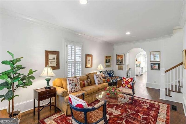 living room featuring dark hardwood / wood-style floors and crown molding