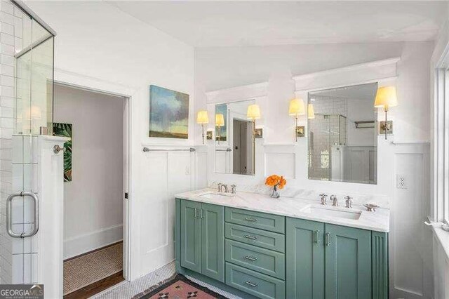 bathroom with an enclosed shower, vaulted ceiling, and vanity