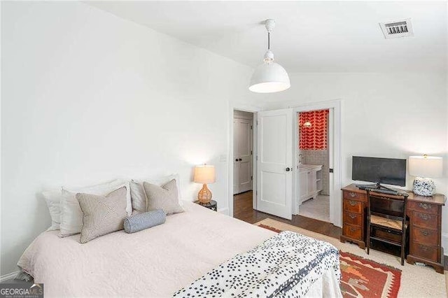 bedroom with vaulted ceiling