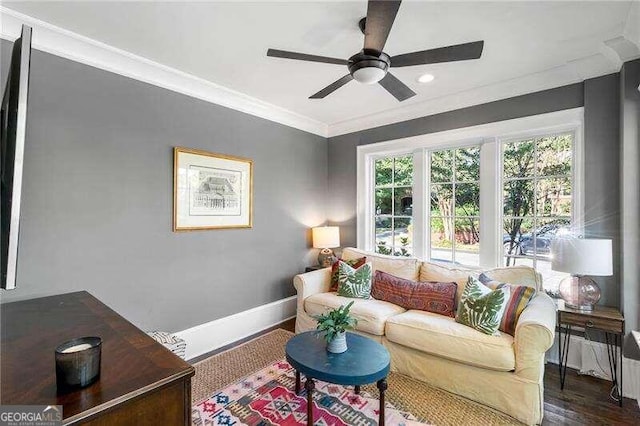 living room featuring ceiling fan, dark hardwood / wood-style floors, and crown molding