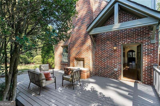 wooden deck featuring an outdoor hangout area