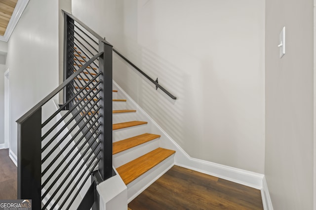 stairs featuring wood-type flooring