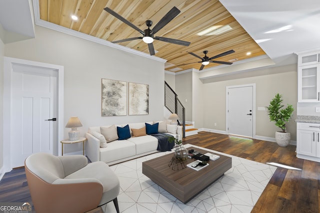 living room featuring crown molding, wooden ceiling, light wood-type flooring, and ceiling fan