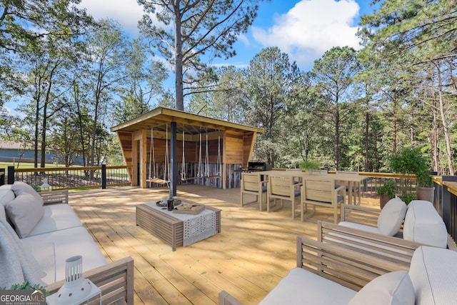 wooden terrace featuring outdoor lounge area