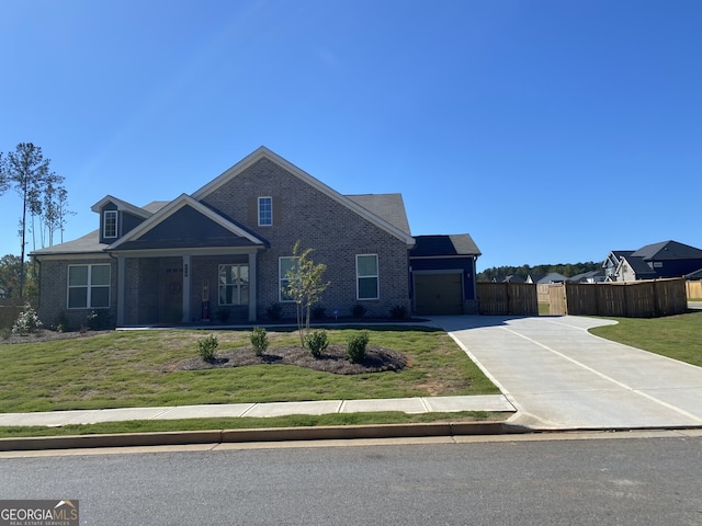 view of front of house featuring a front yard and a garage