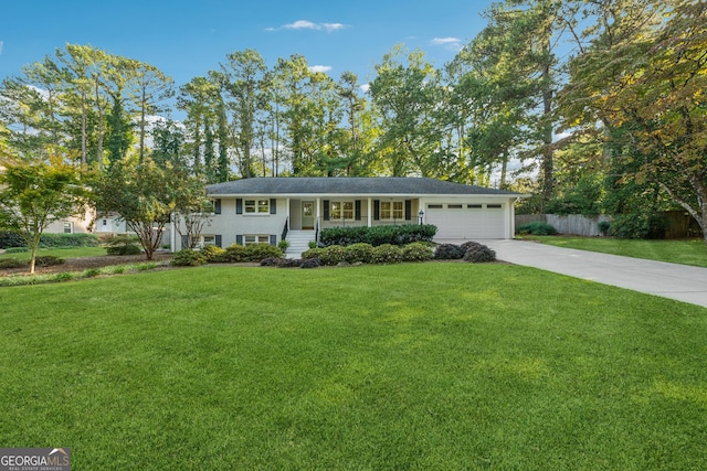 view of front facade with a garage and a front yard