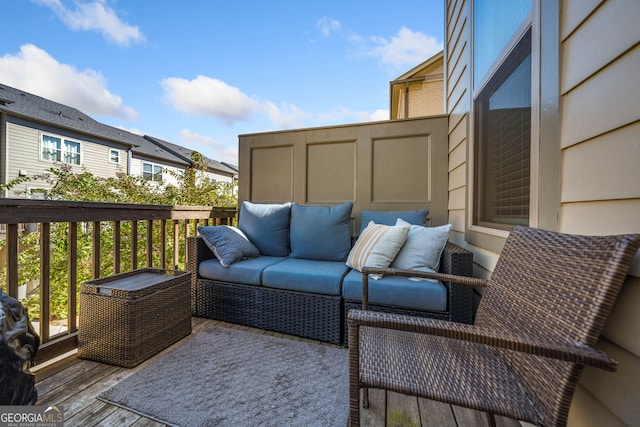 wooden terrace featuring an outdoor living space