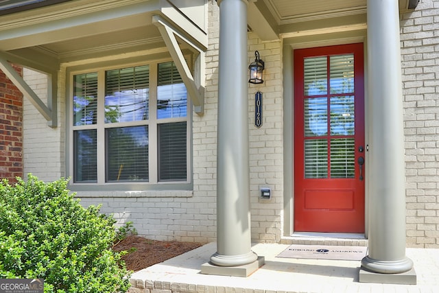 doorway to property featuring covered porch