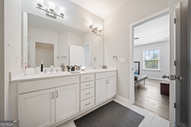 bathroom featuring hardwood / wood-style flooring and vanity