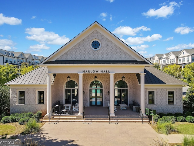 back of house with french doors and a patio area