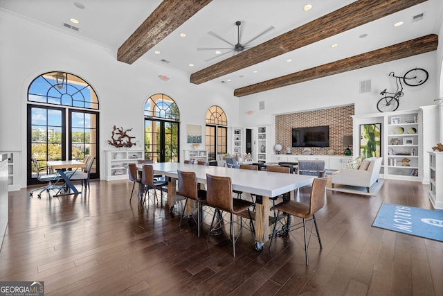 dining area featuring beamed ceiling, ceiling fan, dark wood-type flooring, and french doors