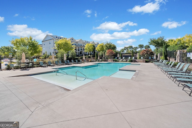 view of swimming pool with a patio area