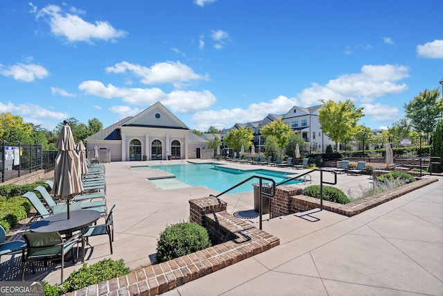 view of swimming pool featuring a patio