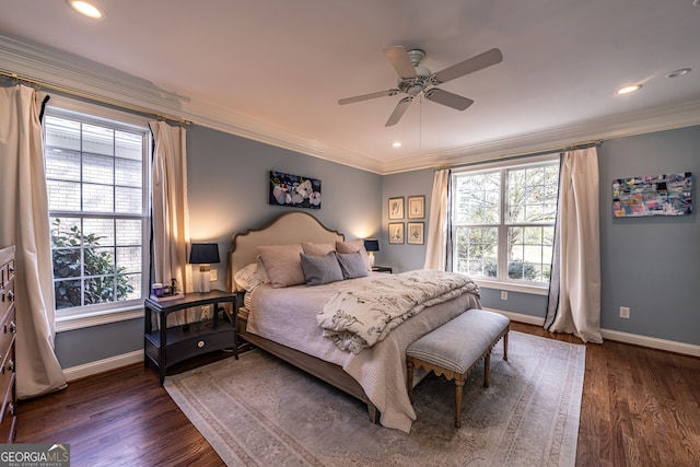 bedroom featuring dark hardwood / wood-style floors, ceiling fan, and crown molding