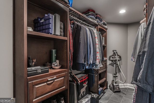 spacious closet with light tile patterned floors