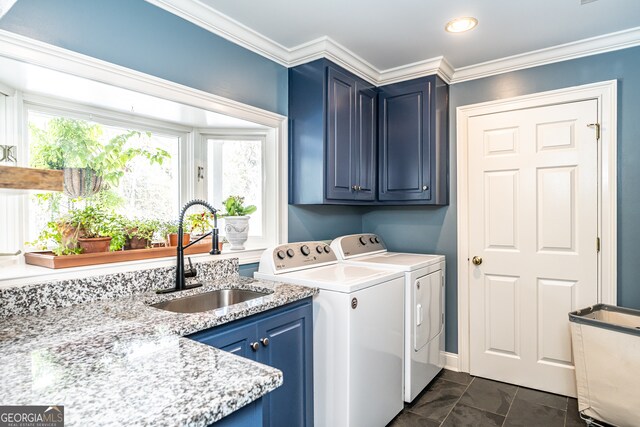 laundry area with washer and dryer, cabinets, sink, and crown molding