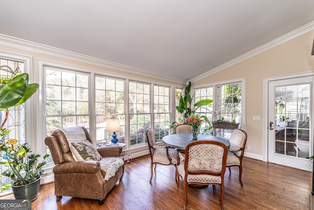 sunroom with lofted ceiling and a healthy amount of sunlight