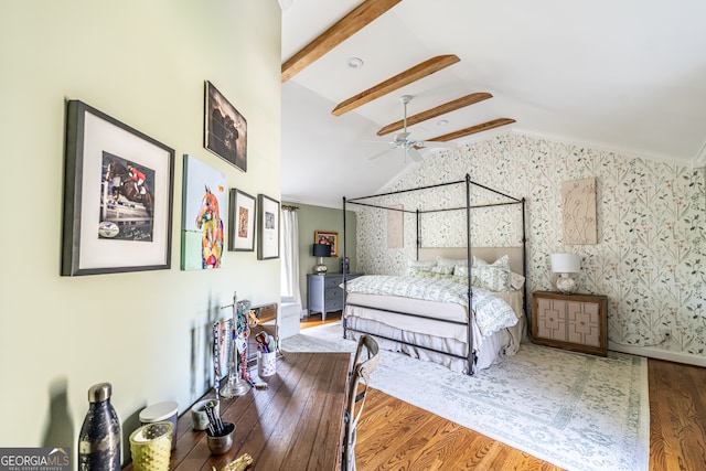 bedroom with vaulted ceiling with beams, hardwood / wood-style flooring, and crown molding