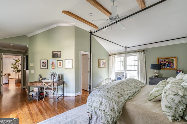 bedroom featuring wood-type flooring, vaulted ceiling with beams, ceiling fan, and ornamental molding