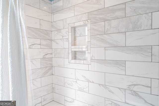 bathroom with curtained shower