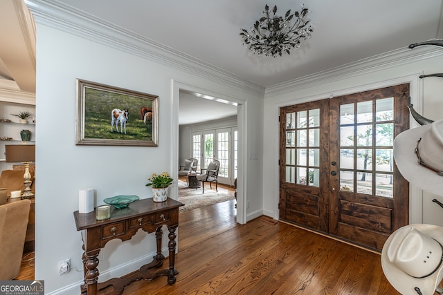 entryway featuring french doors, dark hardwood / wood-style floors, and crown molding