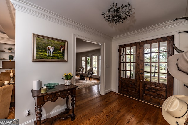 entrance foyer with crown molding, french doors, dark hardwood / wood-style floors, and plenty of natural light