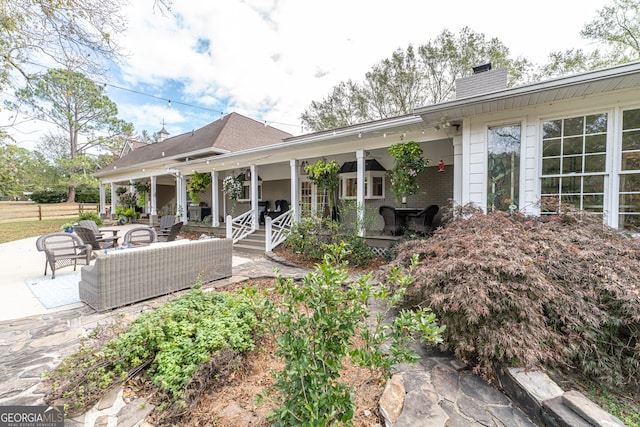 back of house featuring an outdoor hangout area and a patio area