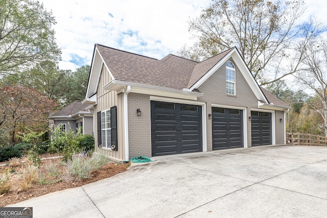 view of side of property with a garage