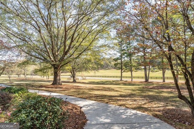 view of home's community featuring a lawn