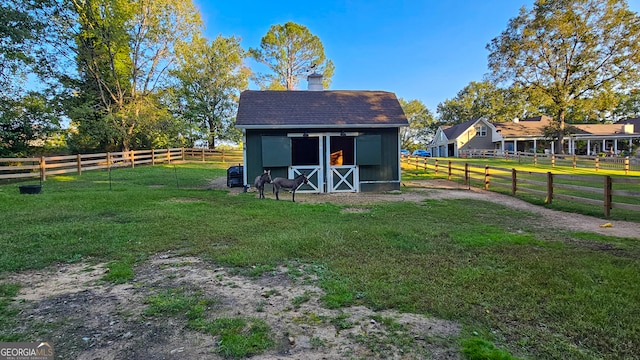 view of outdoor structure with a rural view