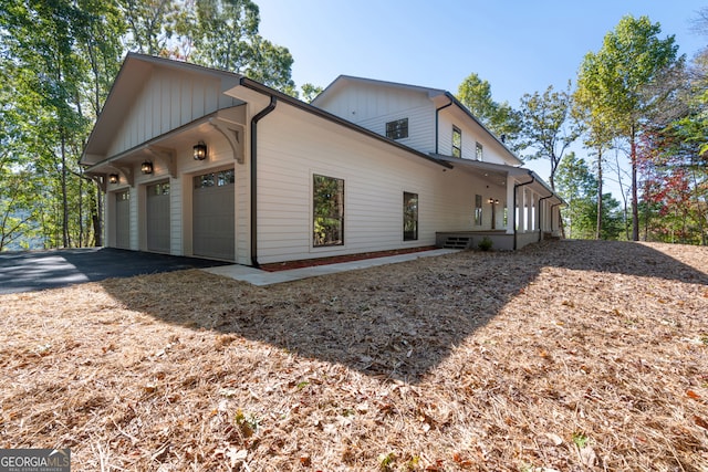 view of side of home featuring a garage