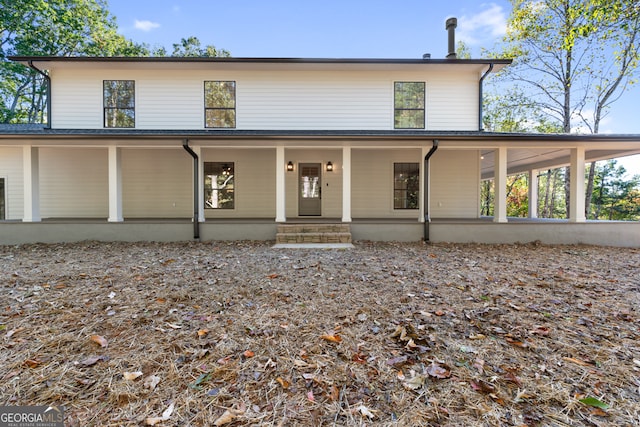 country-style home featuring a porch