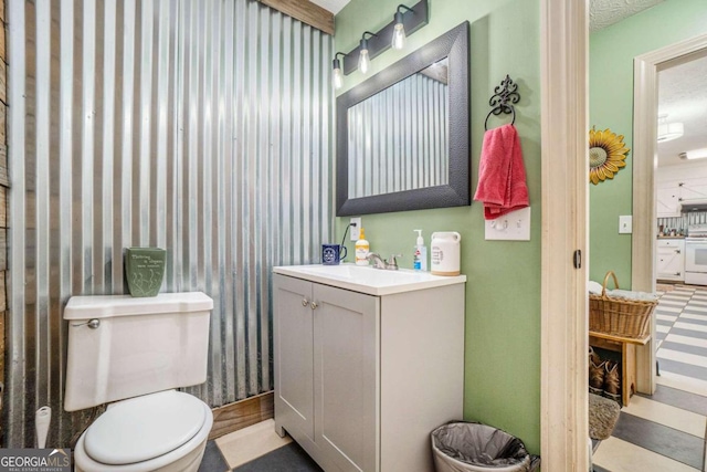 bathroom with toilet and vanity