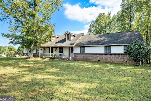 view of front of house with a porch and a front yard