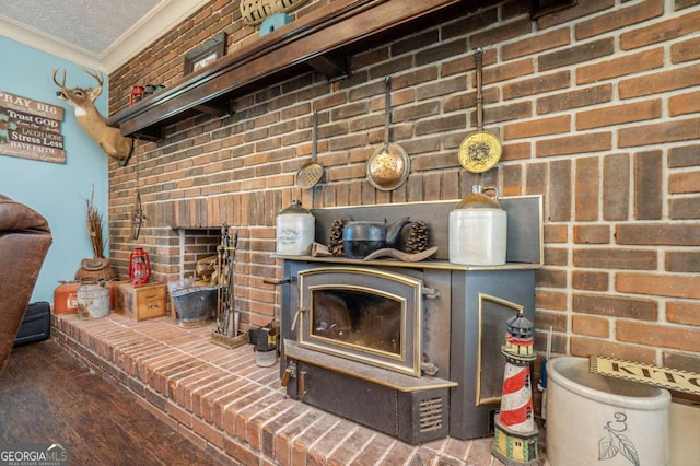 details featuring wood-type flooring, crown molding, and a textured ceiling