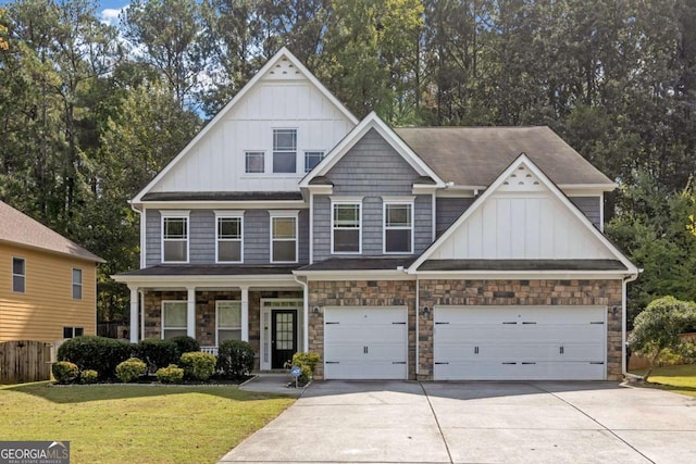 craftsman-style house featuring a front yard and a garage