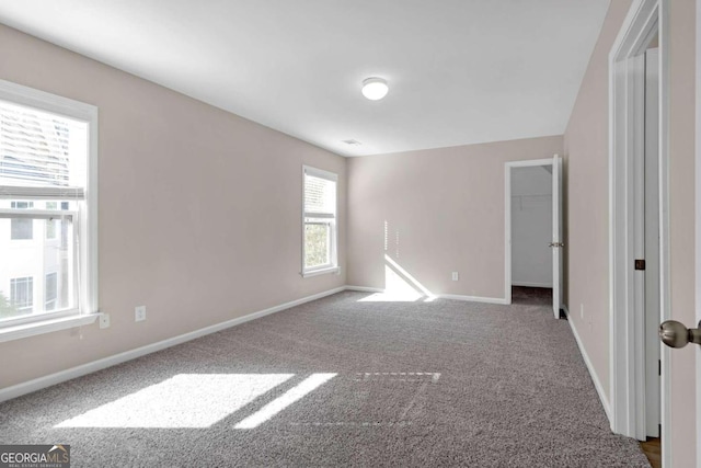 unfurnished room with carpet