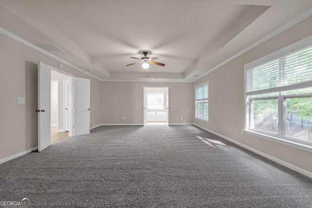 spare room with carpet floors, a raised ceiling, crown molding, and ceiling fan