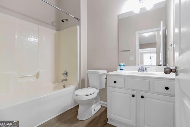 full bathroom with shower / bath combination, vanity, toilet, and wood-type flooring