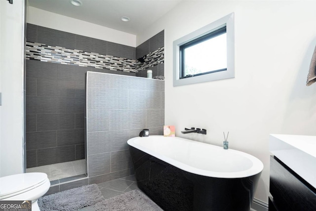 full bathroom with tile patterned flooring, shower with separate bathtub, vanity, and toilet