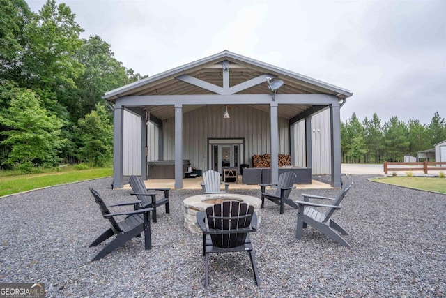 view of patio featuring french doors and a fire pit