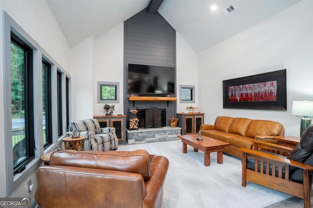 carpeted living room with high vaulted ceiling, a fireplace, beam ceiling, and a wealth of natural light