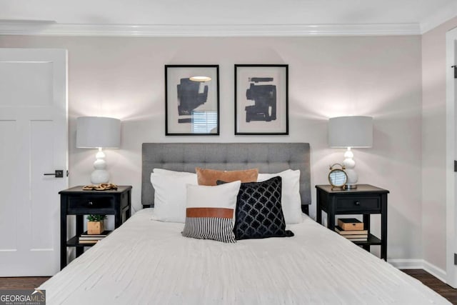 bedroom featuring ornamental molding and dark hardwood / wood-style floors