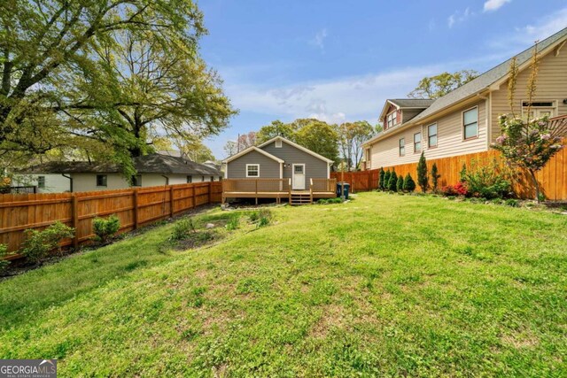 view of yard featuring a wooden deck