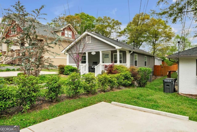 view of front of home featuring a front lawn and a porch